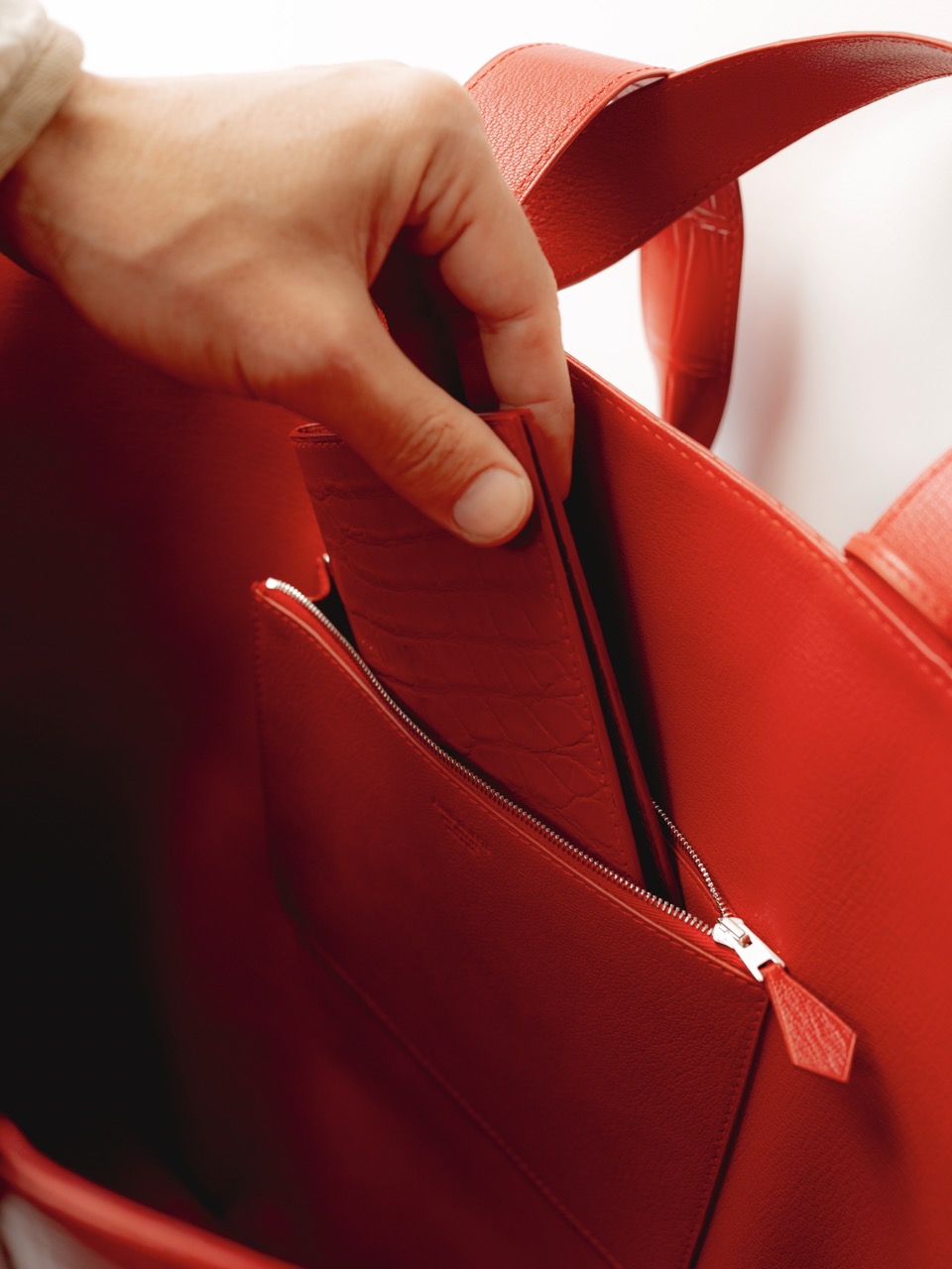 Artisan crafting the bag